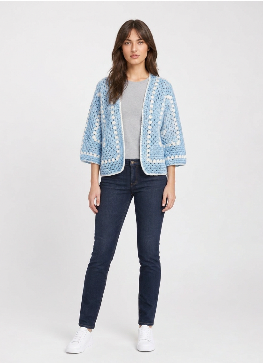 Sky blue open-front crochet cardigan with white granny-stripe trim and three-quarter balloon sleeves, worn over a grey tee.
