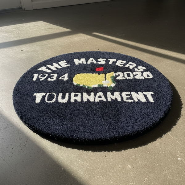 Round hand-tufted navy rug with The Masters Tournament emblem and the years 1934 to 2026 around the border.