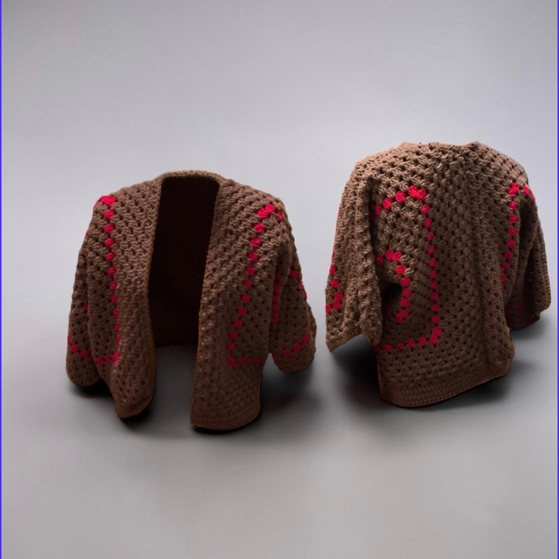 Brown crochet cardigan shown front and back, with pink floral stitching down the sleeves and back.