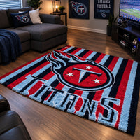 Hand-tufted Tennessee Titans rug in navy, red and light blue with bold vertical stripes and the Titans emblem.